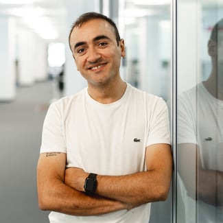 man smiling arms crossed