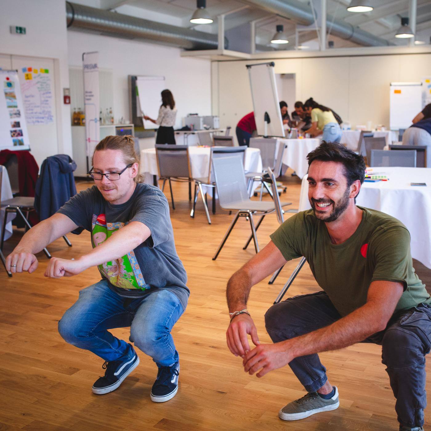 two men doing squats