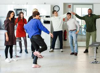young professionals dancing in a workshop